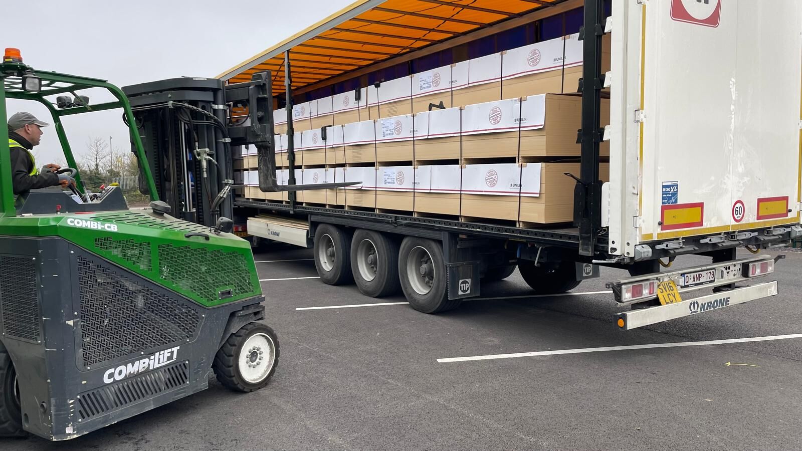 Pallets of goods being loaded onto a URS Choices trailer by forklift